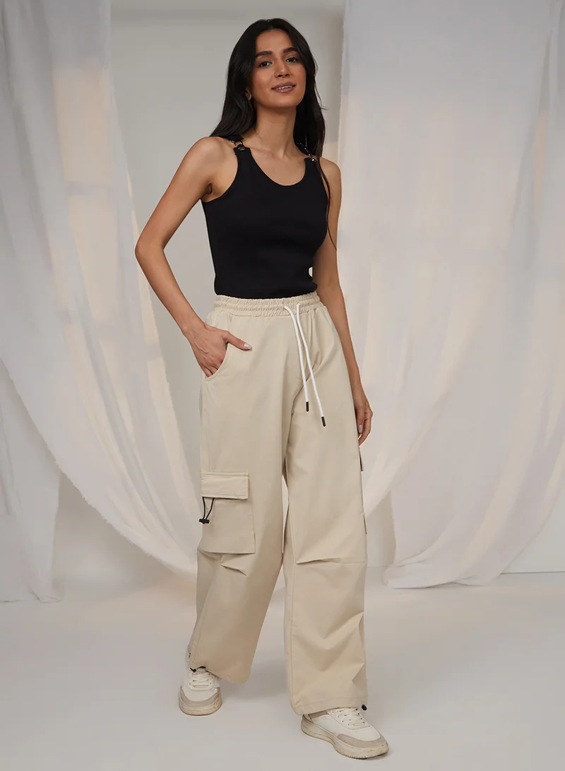 Pinacolada  Women's Beige Solid Cargo Parachute Trousers For Casual Wear | Mid-Rise | 4 Pockets | Drawstring Closure | Cargo Pants Designed With Comfortable Fit For Woman & Girls for Women | Best Price UAE